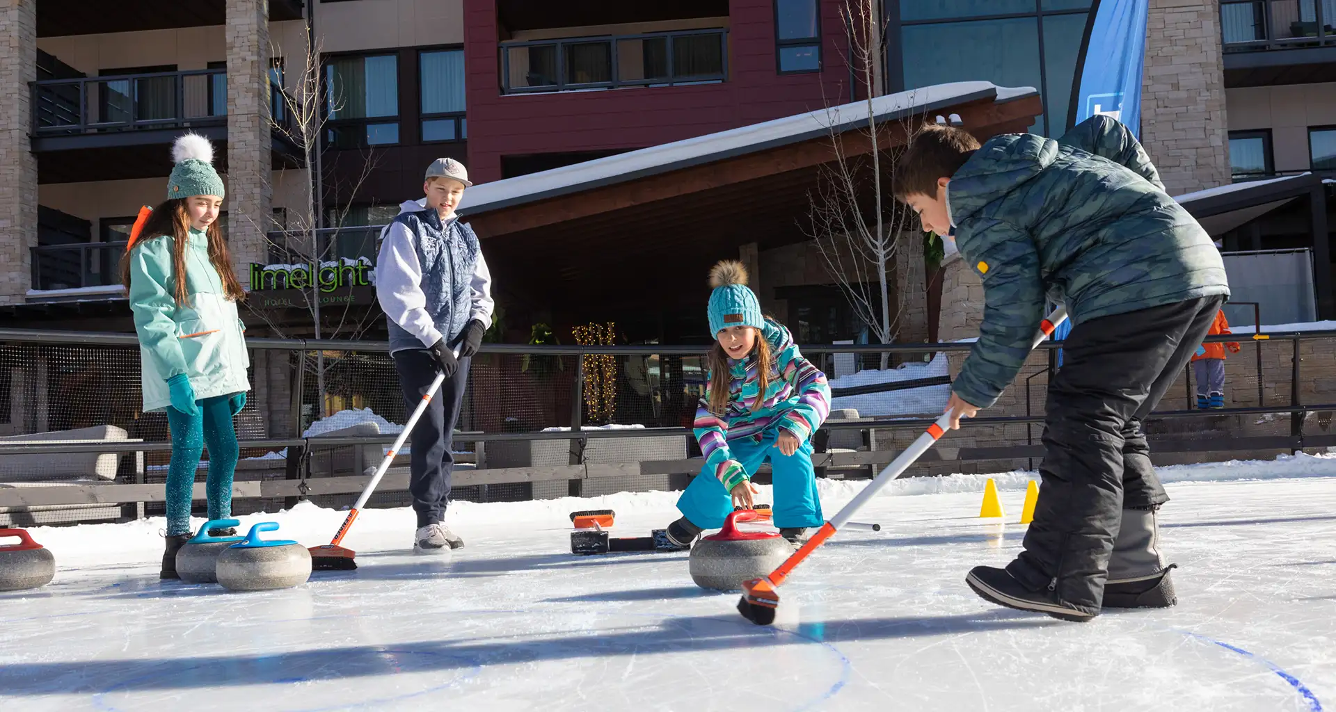 Family curling at Snowmass Base Village