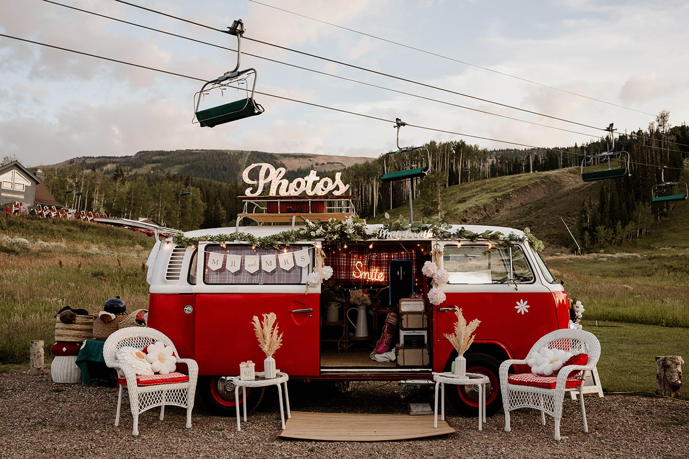 VW Bus and mountain wedding reception lounge under a ski lift at Snowmass