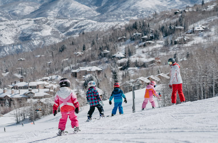 Kids take a ski lesson at Snowmass