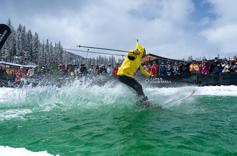 Guy dressed as Banana doing the Pond skim