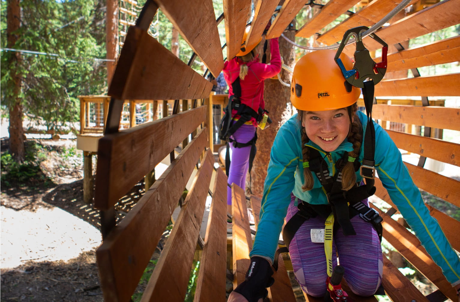Child on a climbing course in Snowmass