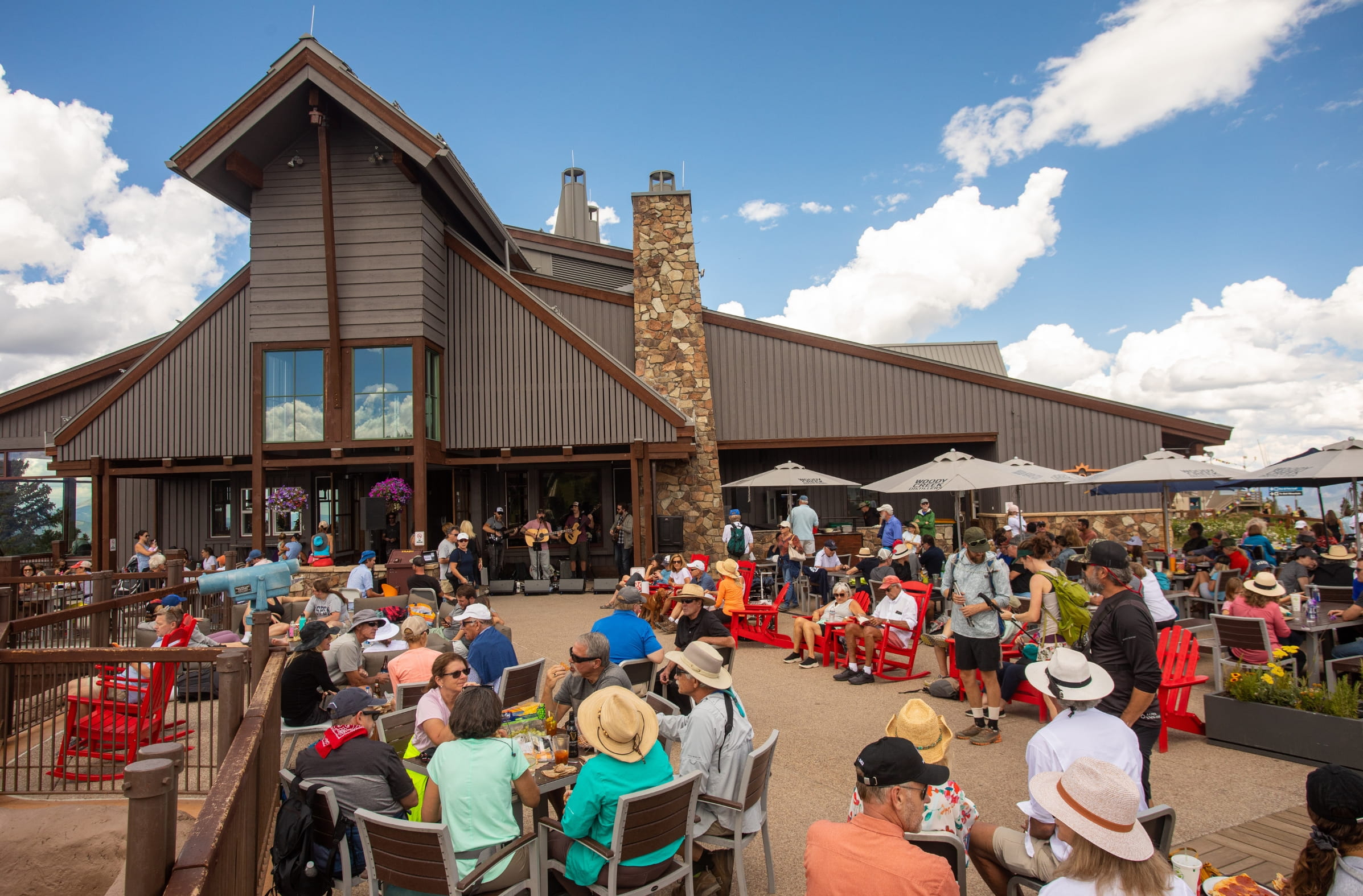 a group of people sitting outside a building
