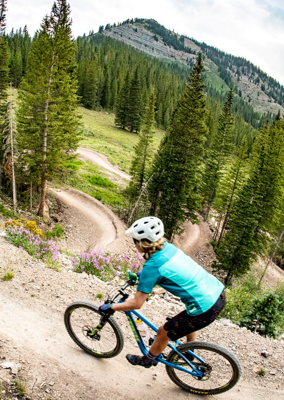 A mountain biker rides on the downhill French Press trail at Snowmass Bike Park.