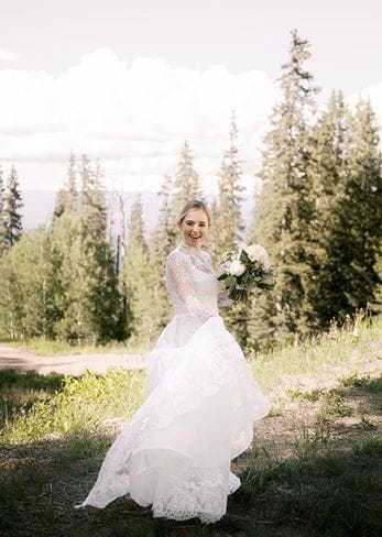 Ashley poses for her bridal portrait at Elk Camp, Snowmass