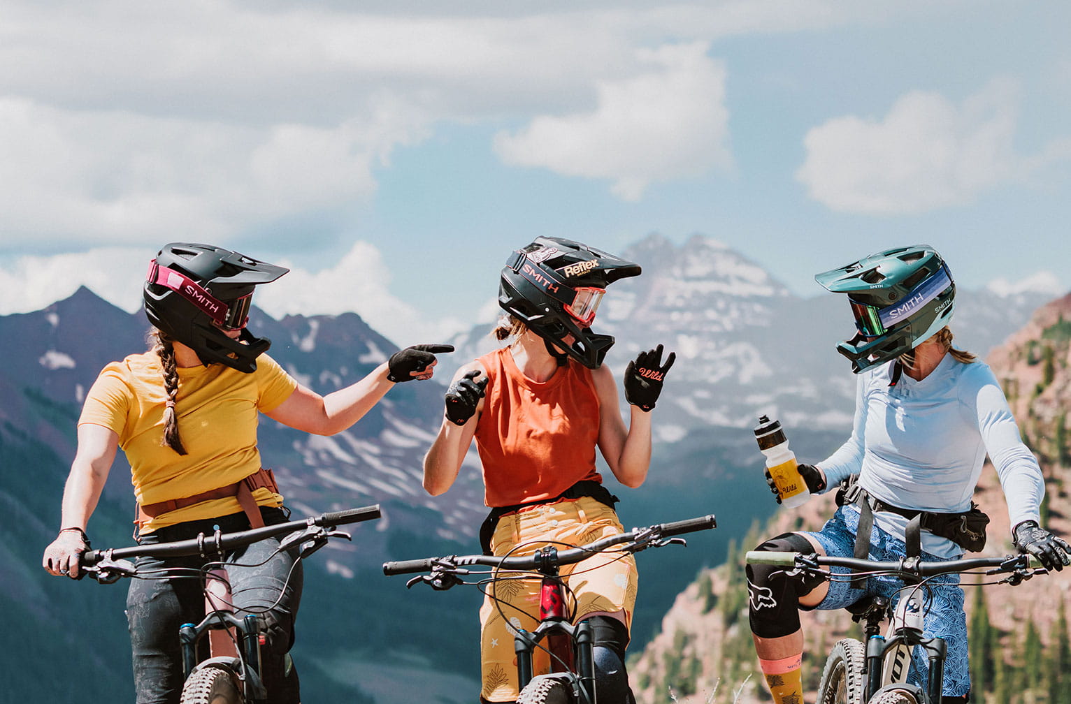 Three people enjoying a bike ride in Snowmass