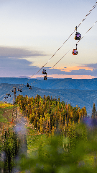 Gondola high above aspen mountain in the summer