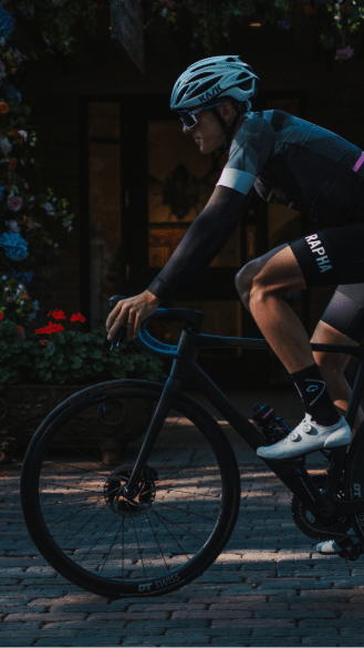 Cyclist on road bike, rented from aspen collection