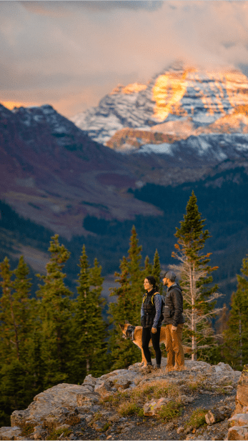 Couple looks over a vista atop snowmass