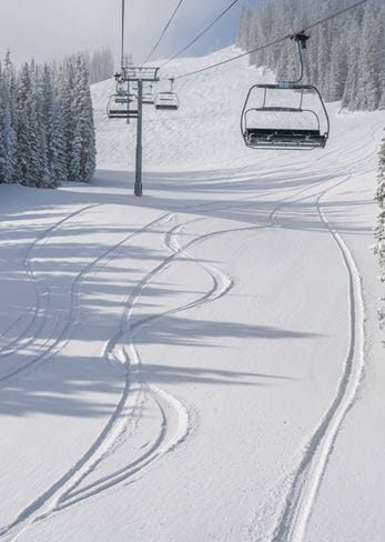 Empty lifts on a powder day at Highlands
