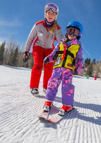 Young child learning to ski at Snowmass