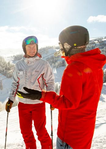 Learning from a ski instructor at Snowmass