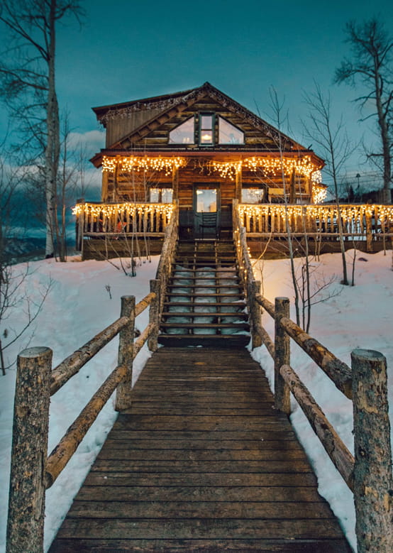 The Lynn Britt Cabin at dusk at Snowmass