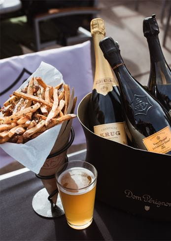 Champagne and truffle fries at Ajax Tavern