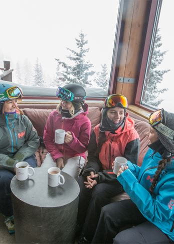 Friends gather for a break at Sundeck atop Aspen Mountain