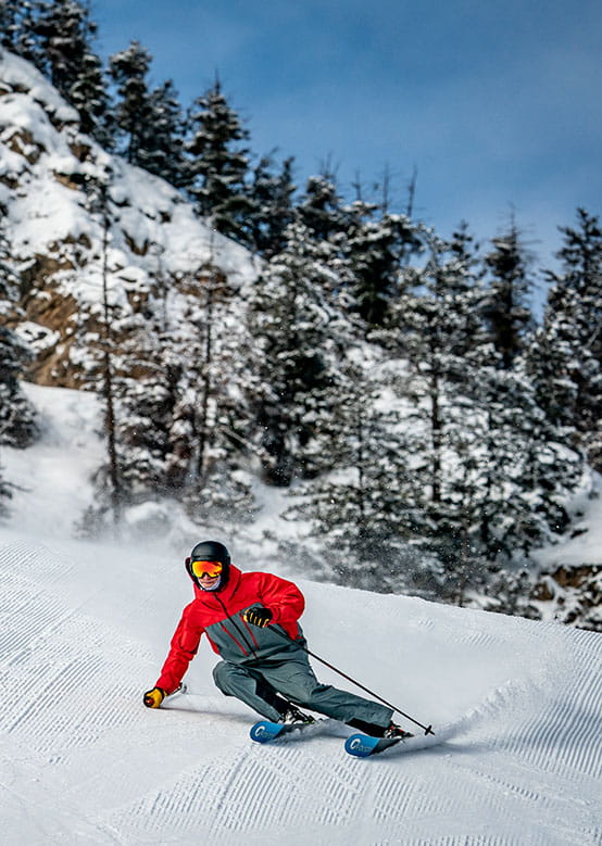 Skier on a beautiful groomer at Snowmass