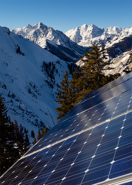 Solar panels in snowy winter valley