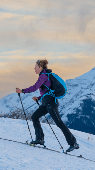 woman skins up Buttermilk, early morning