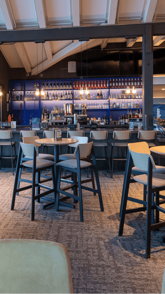Buttermilk mountain lodge bar, blue lights highlight the tall bar stools