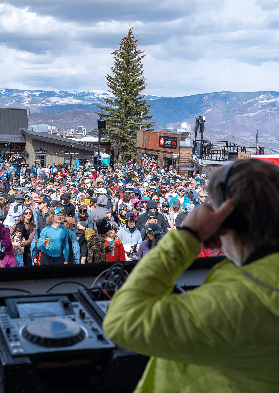 DJ plays for crowd of people at The Cabin during the daily apres scene at aspen snowmass
