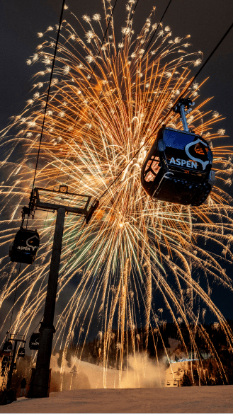 Fireworks explode over the aspen gondola