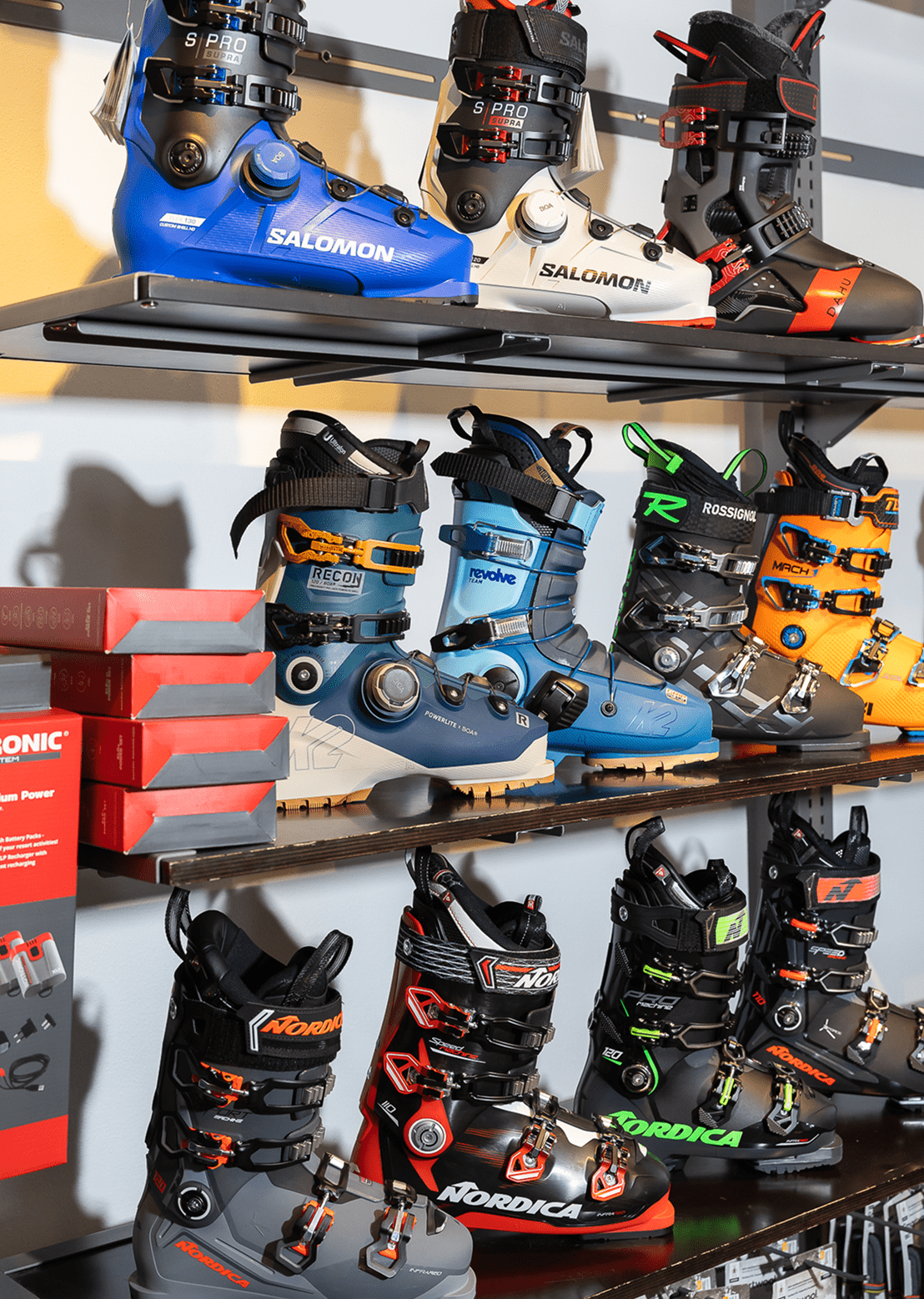 Wall of ski boots displayed on the retail wall at four mountain sports at snowmass