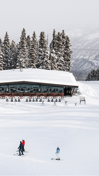 Merry go round on a snowy day, powder on empty slopes above the restaurant 