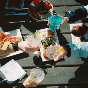 overview of people's cheersing their glasses at Aspen