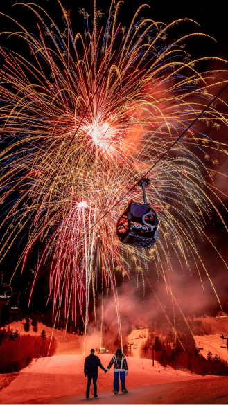 Fireworks over the aspen gondola during New Years Celebration on the mountain