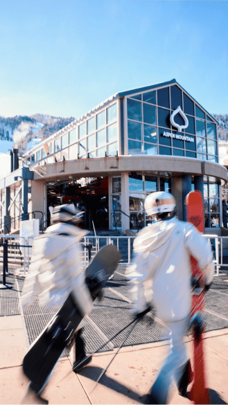 aspen mountain gondola as people load to ski and ride for the day