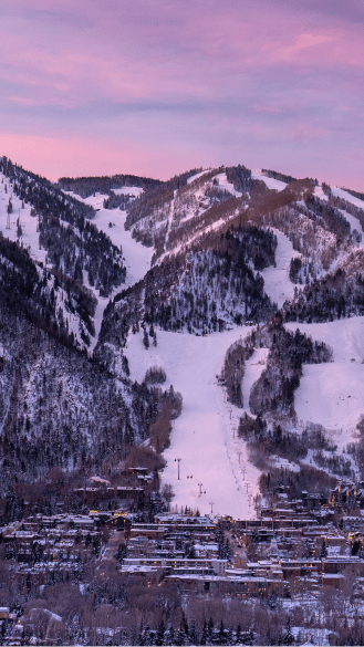 Aspen Mountain at dawn, purple light on the ski slopes