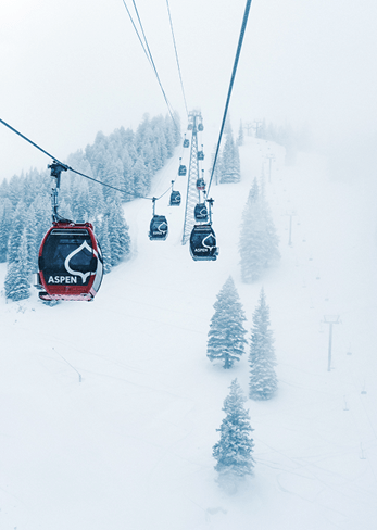 Aspen Mountain gondolas go up the hill 