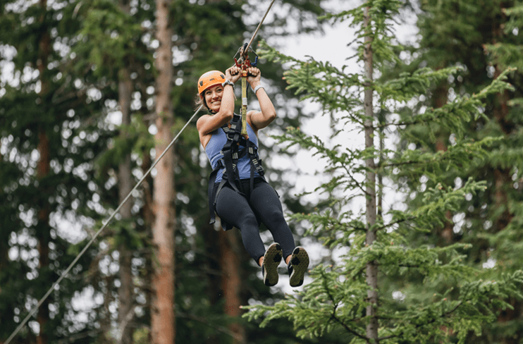 Riding the zipline at the Lost Forest at Snowmass