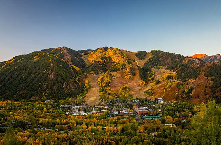Fall color decorates the slopes of Aspen Mountain and the town of Aspen, Colorado