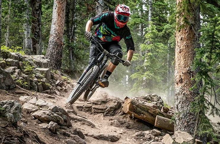 An expert rider takes on a challenging trail at the Snowmass Bike Park