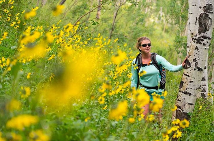 Standing amidst wildflowers on Snowmass