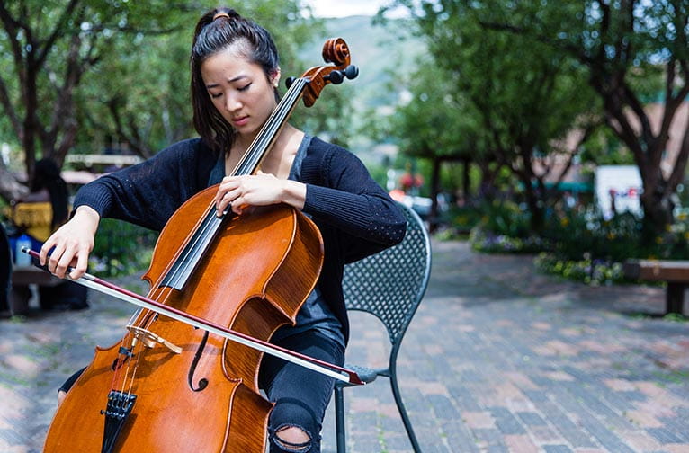 Woman playing cello in downtown Aspen