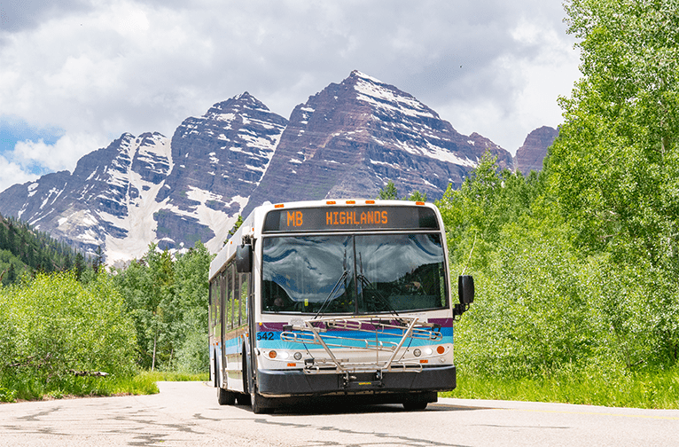 Highlands bus with maroon bells in background