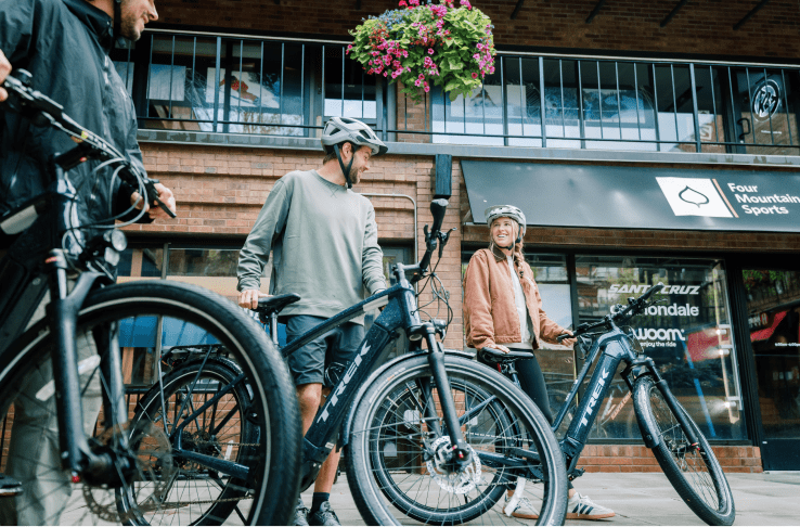 couple checks out their ebikes at aspen four mountain sport locations