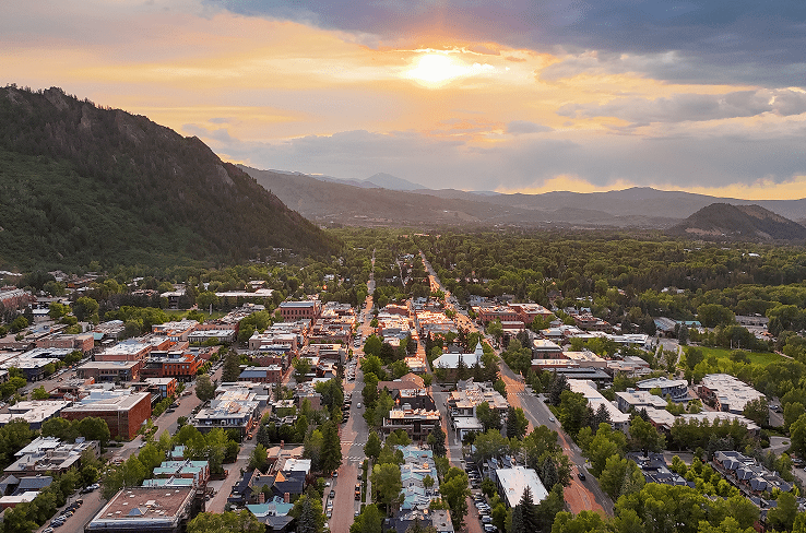 Aerial view of the town of aspen at dusk, during summer
