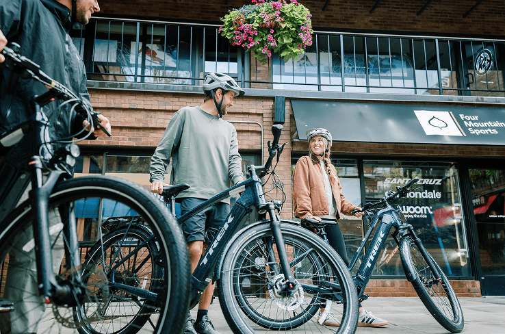 Couple checks out at four mountain sports with their ebike rentals