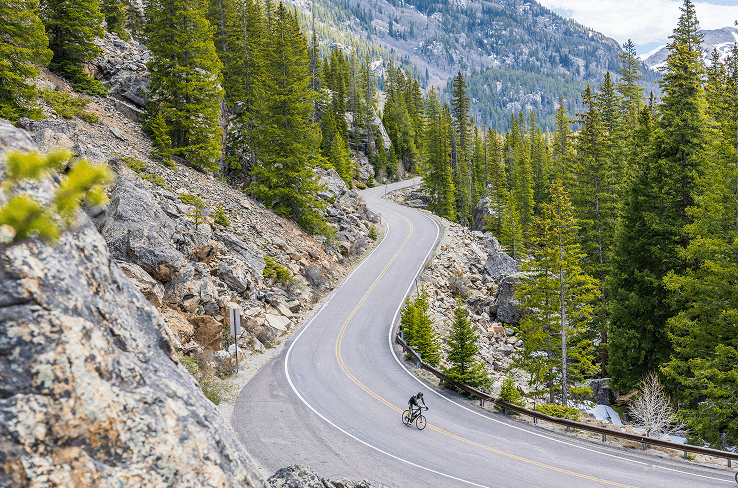 Two road bikers riding up independence pass