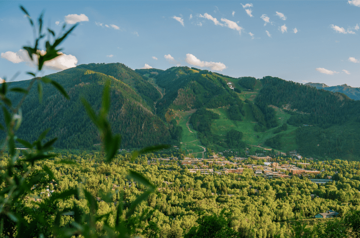 Long shot fo Aspen Mountain in the summer, town sits at the base of the mountain