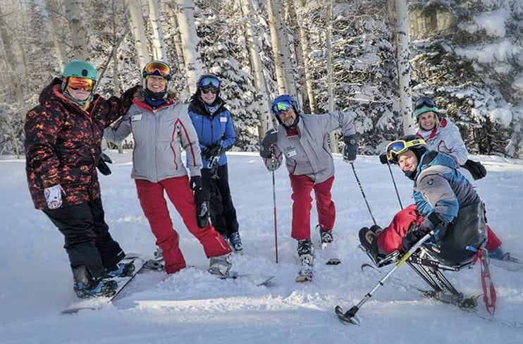 A group of military veterans skiing with the CAMO program at Aspen Snowmass