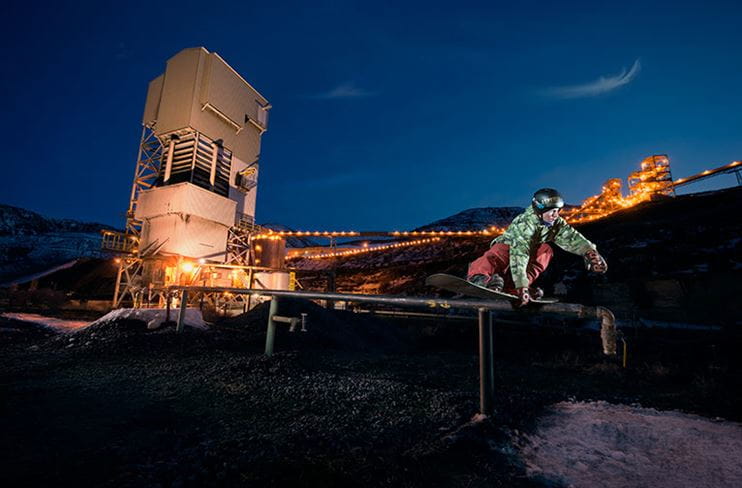 A snowboarder rides a rail beneath the Somerset Coal Mine