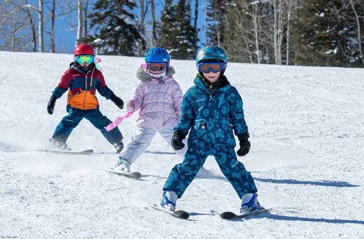 Four-year-old children learn to ski at Snowmass