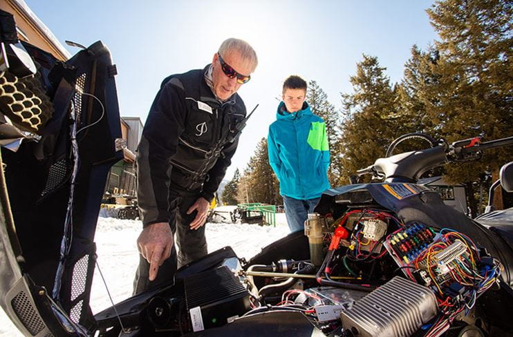 Father and son convert a snowmobile to electric power