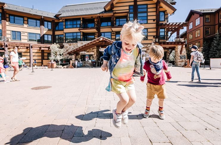 Kids play outside in Snowmass Village