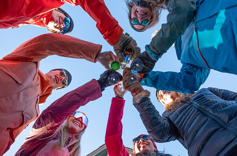 a group of people holding wine glasses