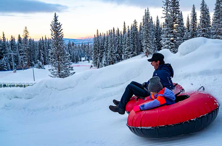 Tubing at dusk at Snowmass