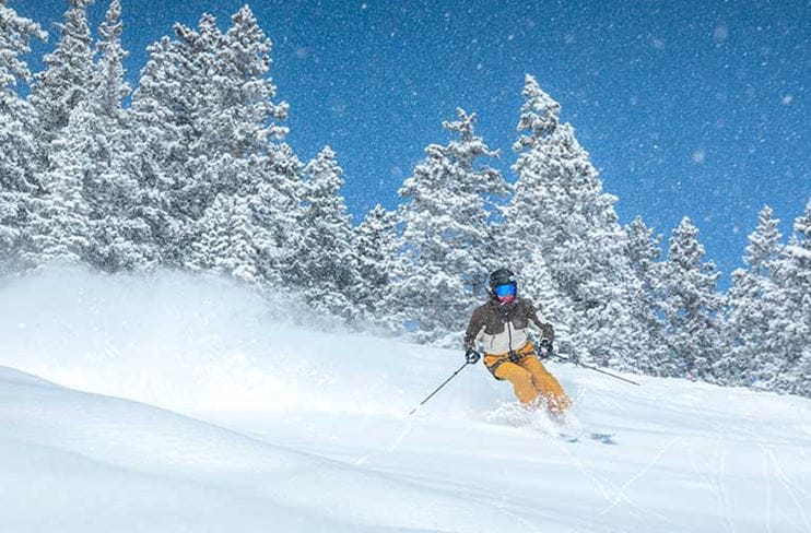 A skier enjoys pristine snow conditions at Aspen Snowmass